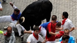 Two Gored in Spains Pamplona Bull Run [upl. by Lucchesi]