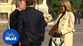 Putin gifts Brigitte Macron flowers as Emmanuel Macron visits Russia [upl. by Lucienne]