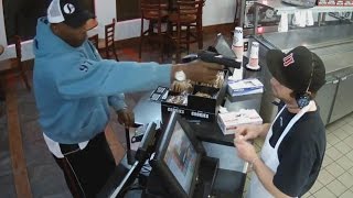 Watch Unfazed Cashier Keep His Cool During Terrifying Gunpoint Robbery [upl. by Einhpad296]