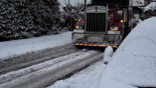 big rig truck pulls 18 wheeler uphill in snow [upl. by Ordway]